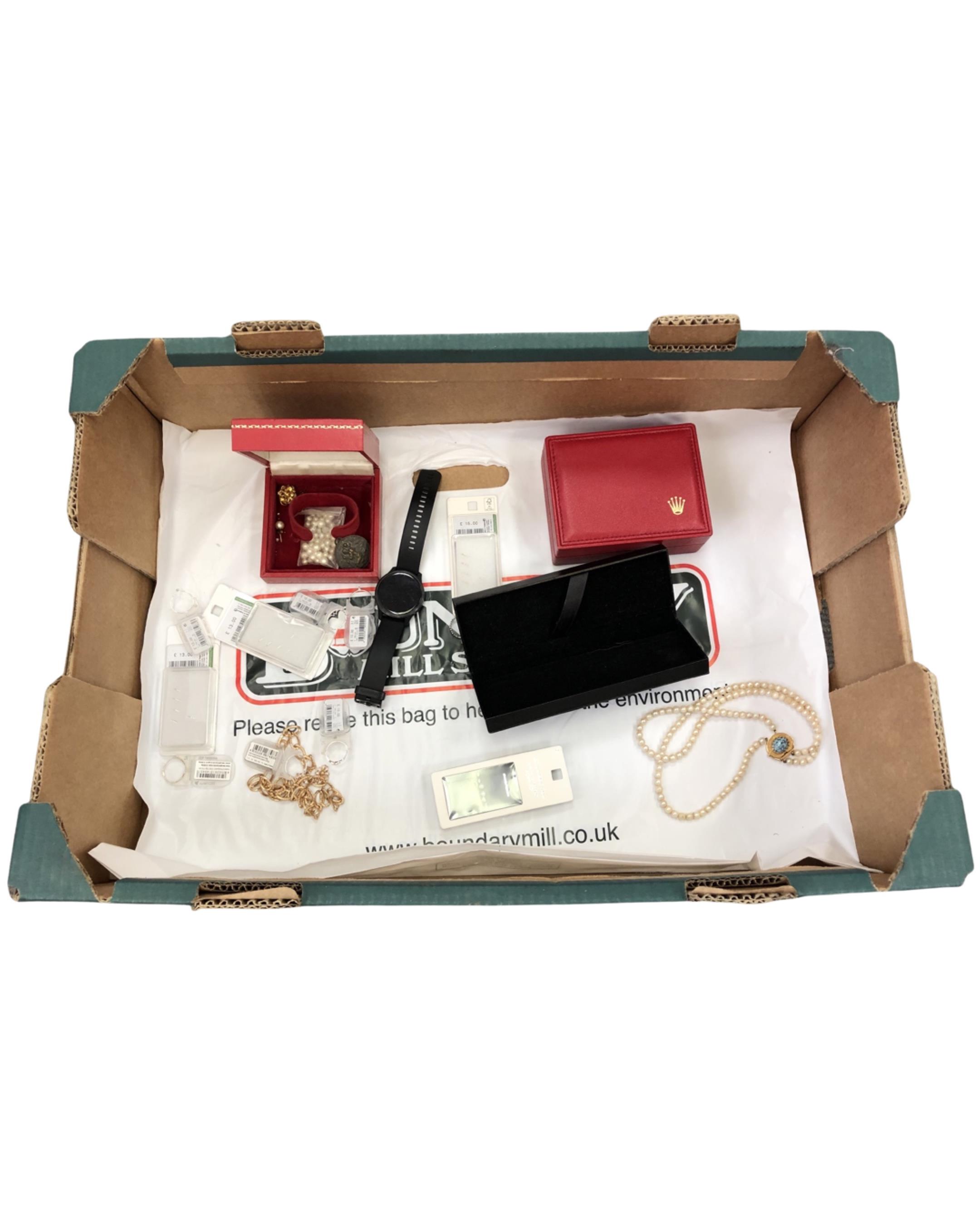 A box containing Garmin watch, costume jewellery, St Christopher pendant,