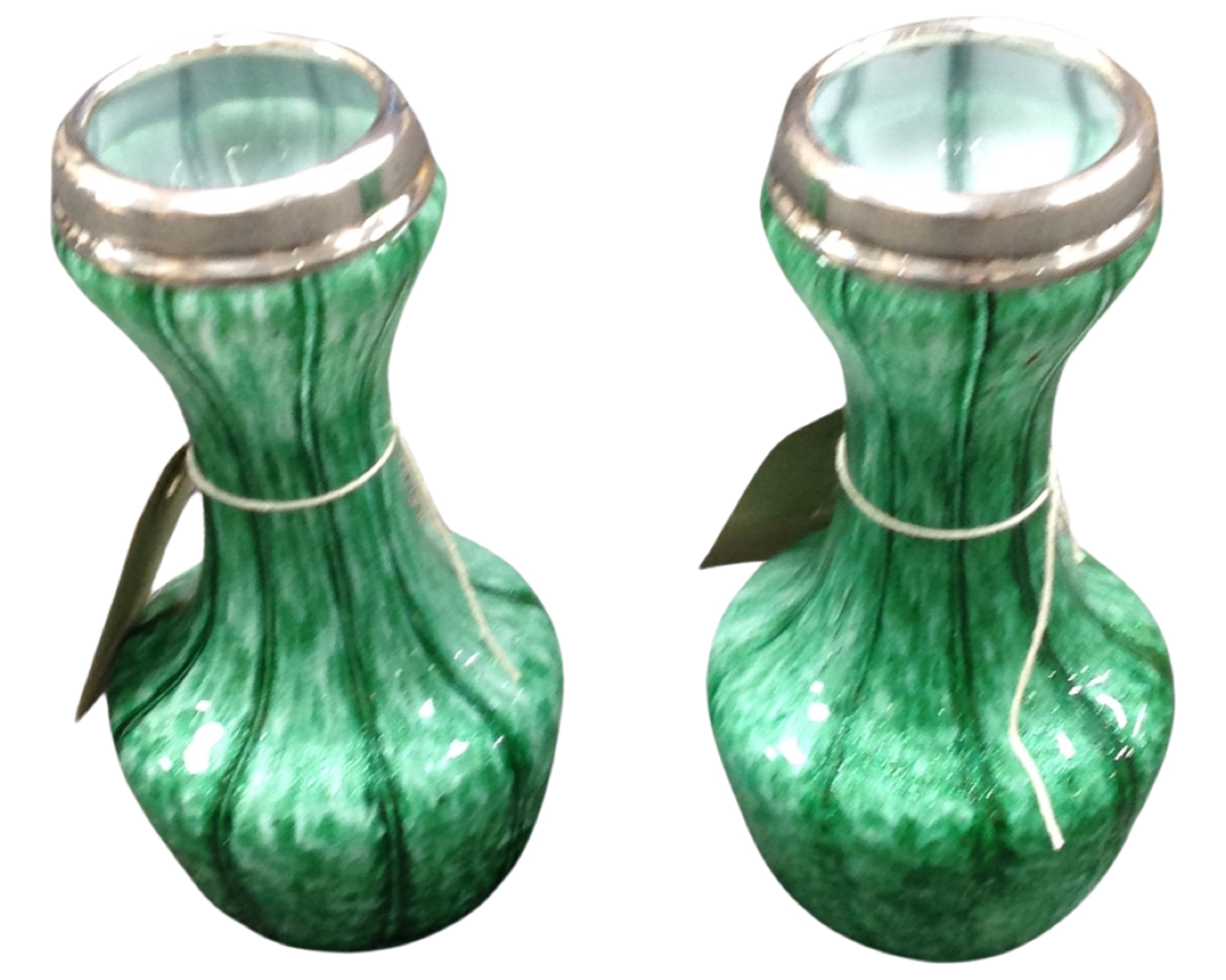 A pair of Art Deco silver-rimmed green glass vases, London marks, 1928, height 16 cm.