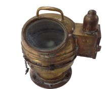 A vintage brass ship's binnacle.