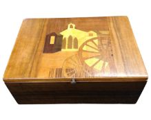 An inlaid wooden jewellery box.