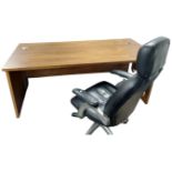 A contemporary walnut effect computer desk (width 180cm), together with a leather swivel chair.
