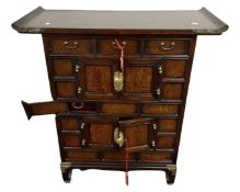 A Chinese elm altar cabinet fitted with drawers.