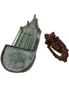 A cast metal door knocker together with a metal and glass exterior light.