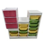 A contemporary bank of storage drawers together with a further plastic three drawer chest.