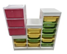 A contemporary bank of storage drawers together with a further plastic three drawer chest.