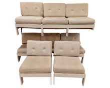 A late 20th century Scandinavian set of eight lounge chairs in beige upholstery.