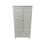A contemporary white double door wardrobe fitted with two drawers