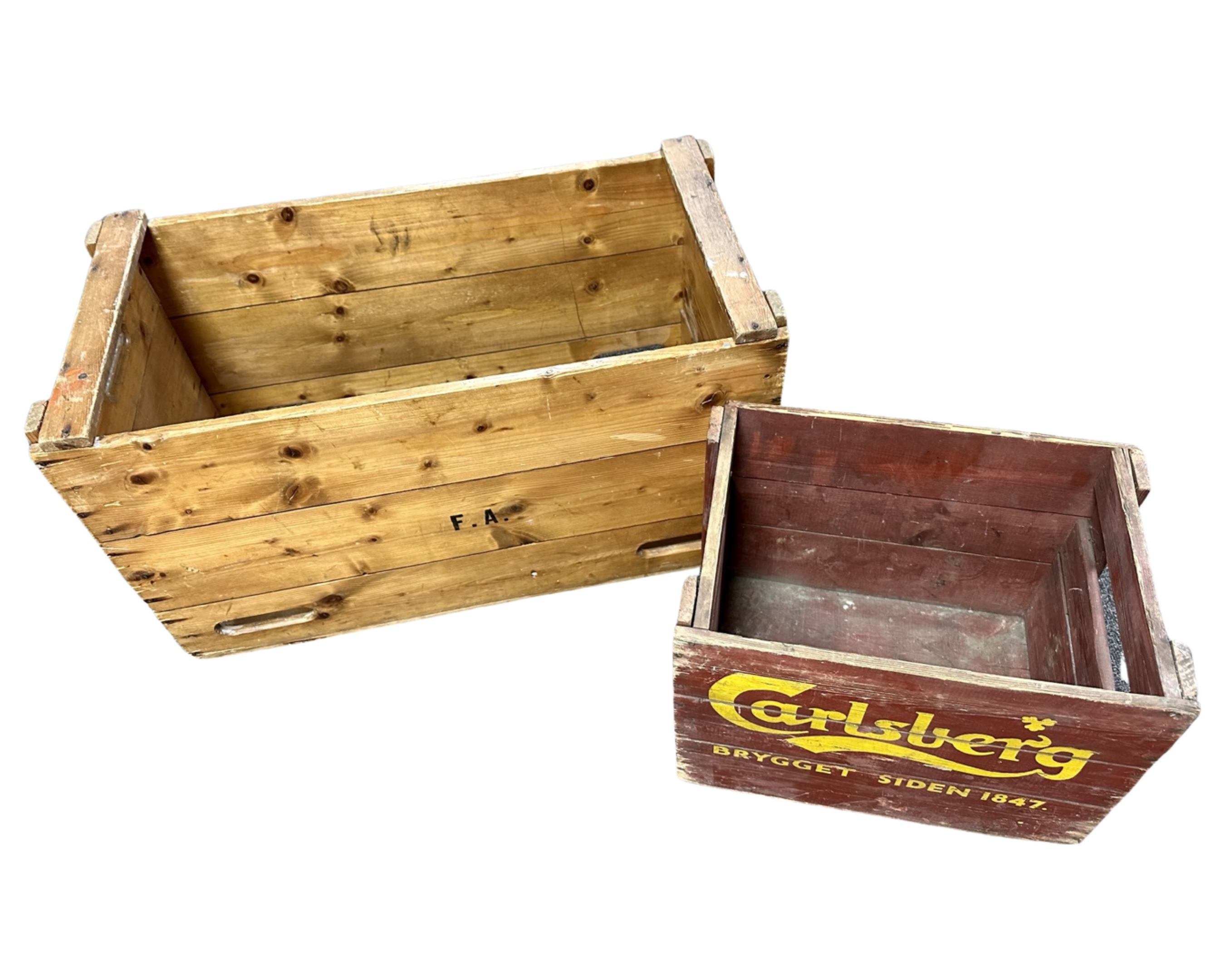 A pine crate together with a painted Carlsberg crate