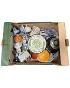 A box containing Chinese ceramics including a Famille Rose lidded cylindrical jar,