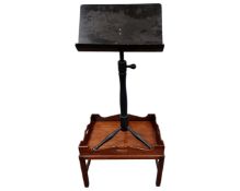 A teak serving tray on stand together with a stained wooden music stand.