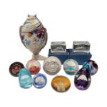 A Murano glass fish together with a quantity of commemorative glass paperweights.