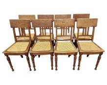 A set of eight oak dining chairs with bergere seats.