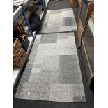 Two contemporary rugs on grey ground, 186cm by 120cm.