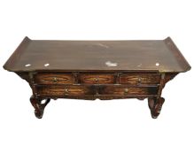 A Chinese style elm low altar table fitted with five drawers.