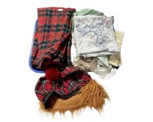 A tray containing a tartan kilt, a tam o' shanter and a quantity of lace and linen.
