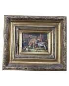 A gilt framed oil on panel depicting two donkeys and a chicken in a barn, 16cm by 11cm.