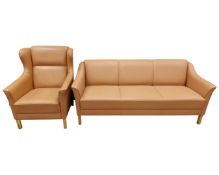 A Scandinavian three seater settee in tan leather upholstery (width 181cm),