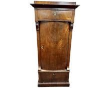 A 19th century Continental mahogany bow fronted sentry door cabinet.