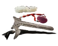 A South-East Asian Kris dagger with white metal mounts together with a carved jade ruyi sceptre and