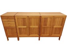 A pine effect three section sideboard.