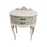 A French style two drawer bedside cabinet on cabriole legs.
