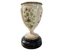 A Victorian transfer printed pottery vase on socle.