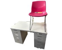 A contemporary white twin pedestal desk fitted with ten drawers together with a plastic chair.