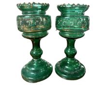 A pair of late Victorian green glass table lustres together with a quantity of crystal drops.