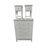 A contemporary white six drawer chest together with a pair of matching bedside tables
