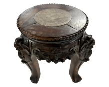A miniature Chinese carved hardwood and inset marble jardiniere stand.