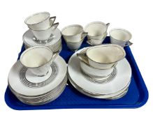 A collection of 36 pieces of Royal Doulton silvered tea china