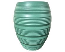 Keith Murray for Wedgwood : A turquoise glazed ribbed vase,