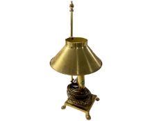 A brass rise and fall table lamp.