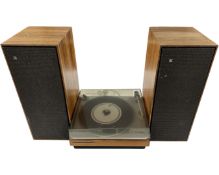 A Bang & Olufsen Beogram 1000 turntable together with a pair of Bang & Olufsen teak cased speakers.