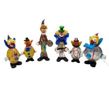 Six Murano glass clowns.