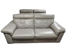 A pair of contemporary Natuzzi grey stitched leather three seater settees (length 212cm),