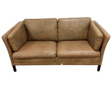 A Scandinavian two seater settee upholstered in olive leather.