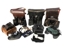 A tray of antique and later binoculars and monoculars including Carl Zeiss, Nikon etc.