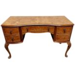 A Queen Anne style burr walnut veneered dressing table.