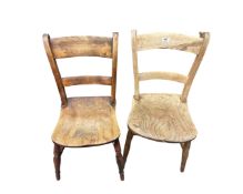 Two oak farmhouse style chairs.