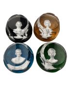 Four Baccarat glass paperweights depicting members of the Royal Family.