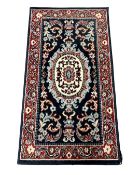 A small eastern woolen rug 106 cm x 60 cm