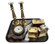A tray containing an oak barometer (AF), a pair of brass candlesticks and three mantel clocks.