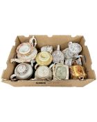 A box containing 19th century and later ceramic teapots.