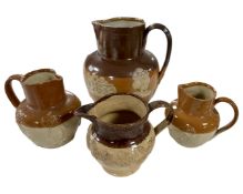 Four stoneware jugs.