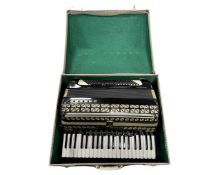 A Hohner Atlantic III piano accordion, in carry case.
