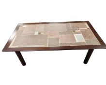 A Scandinavian tile topped rectangular coffee table.