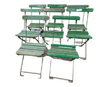 A set of eight painted wood and folding metal garden chairs.