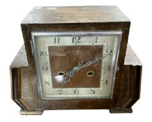 An oak Art Deco mantel clock.