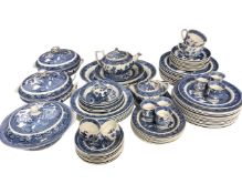 Approximately 77 pieces of Wedgwood blue and white willow pattern tea and dinner china.